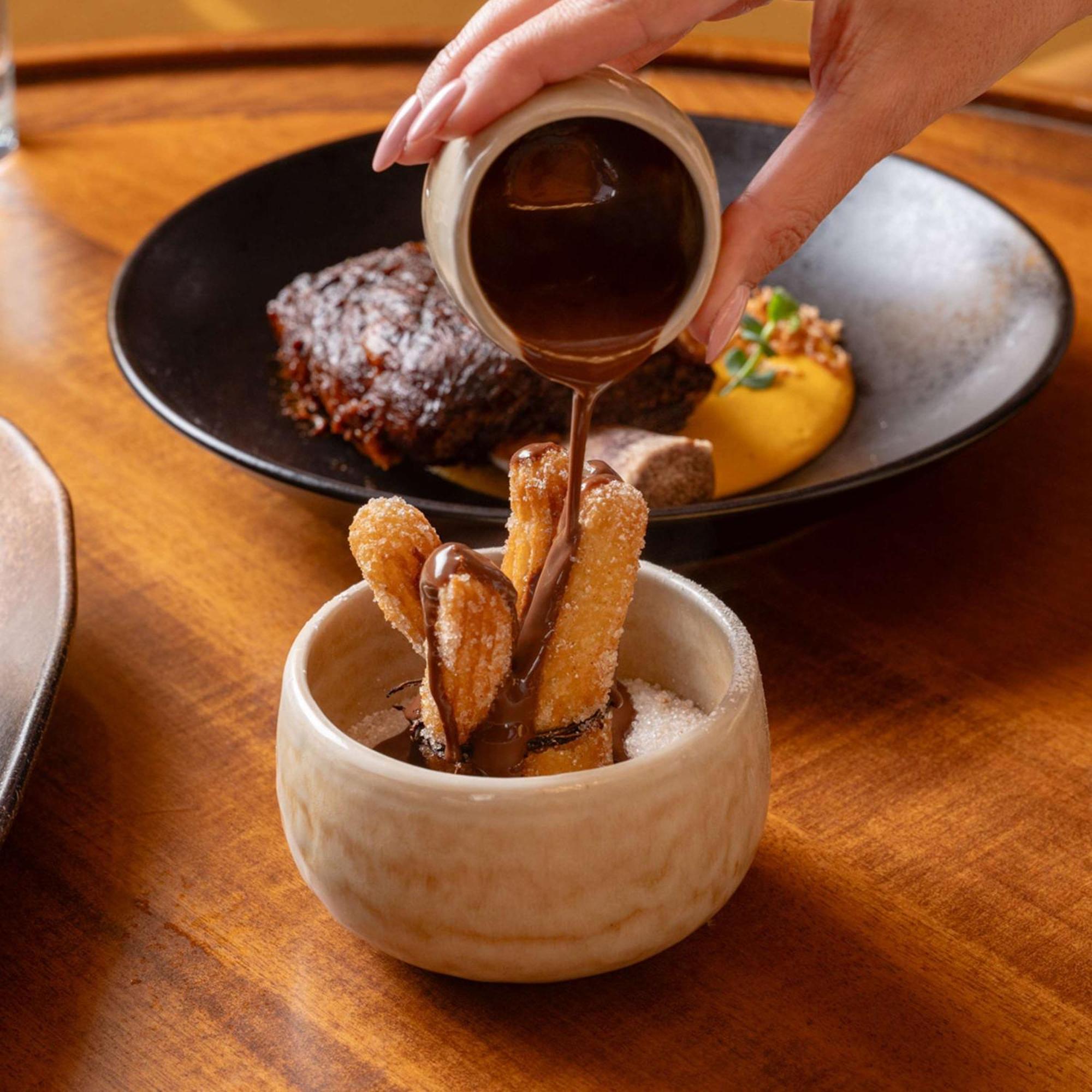 V Hotel Dubai, Curio Collection By Hilton Eksteriør bilde Soy sauce being poured on tempura